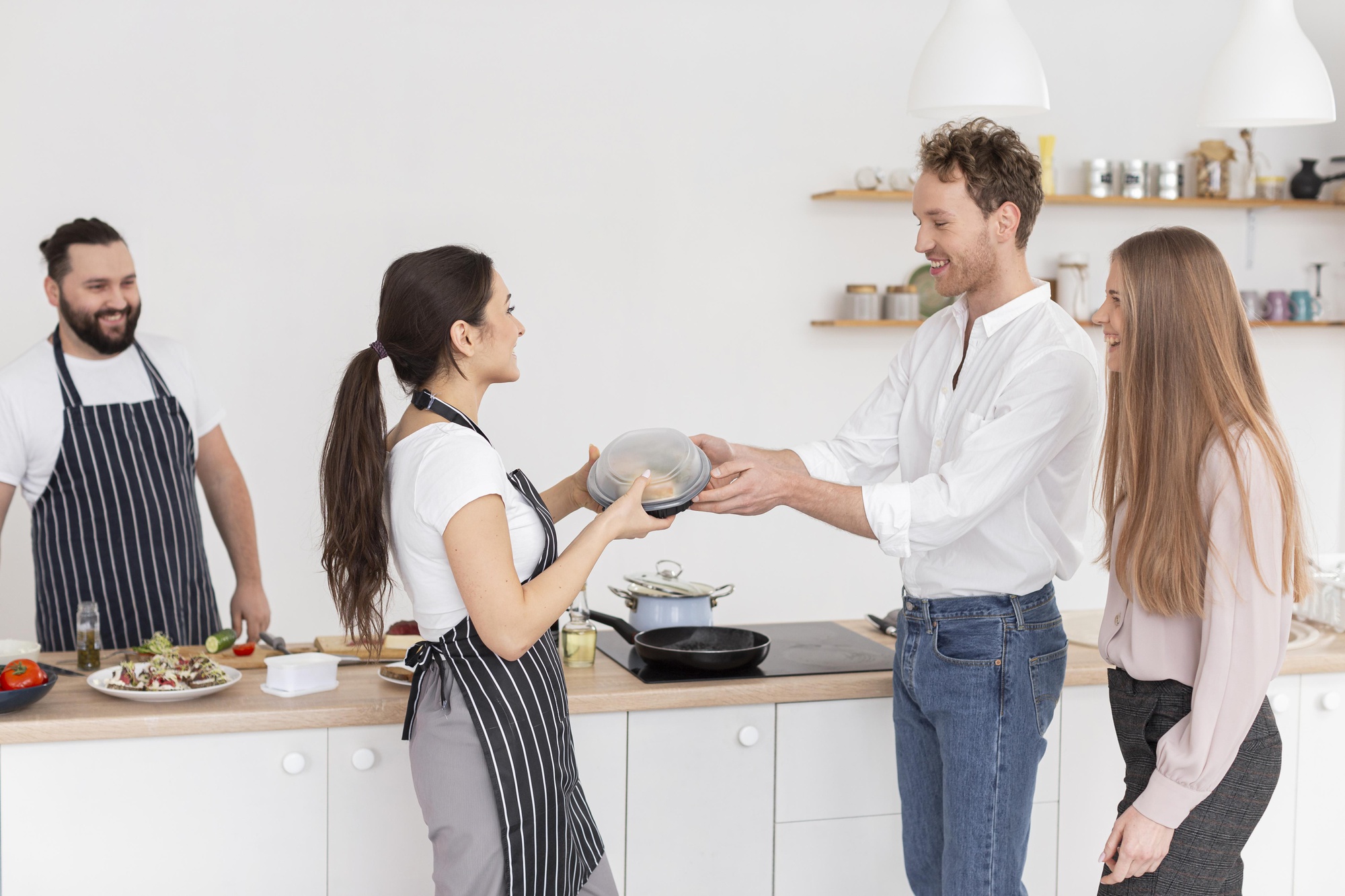 Chef guiding a small group at stove